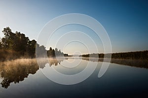 Foggy river at sunrise.