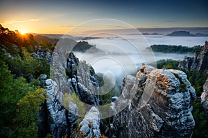 Foggy sunrise at Bastei, Saxon Switzerland, Germany photo