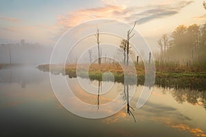 Foggy sunrise over the lake in Mazury region, Poland in impressionism style