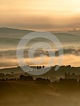 Foggy Sunrise over tuscan Hills