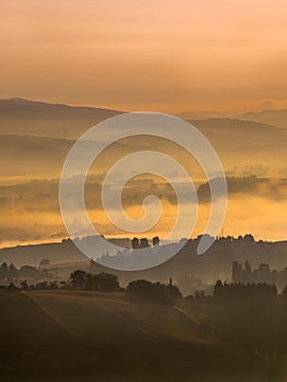 Foggy Sunrise over tuscan Hills