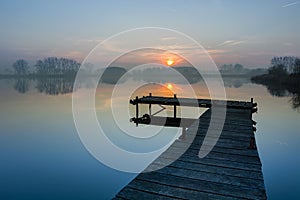 Foggy sunset at the lake