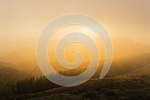 Foggy sunset in mountain