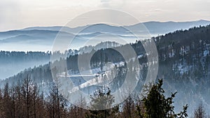 Foggy view of Beskid Sadecki mountain range in Poland