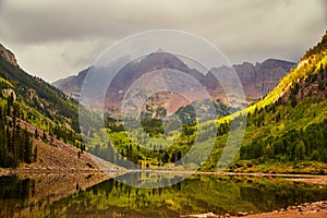 Foggy view in fall of majestic maroon bells mountains in Colorado