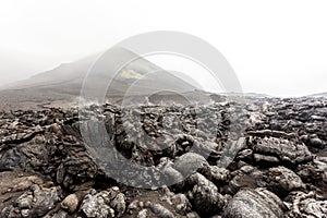 Foggy volcanic landscape near Volcano Tolbachik in the overcast weather. Kamchatka, Russia