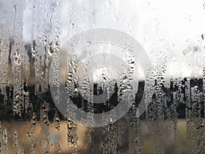 Foggy window. Closeup shot of a steamy window with water drops