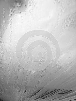 Foggy window. Closeup shot of a steamy window with water drops