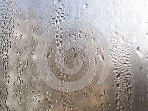 Foggy window. Closeup shot of a steamy window with water drops