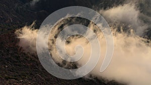 Fogs roll in from the sea billowing over the Dhofar mountain