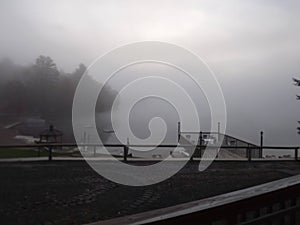 Fogy morning view of water, dock at the DUDE RANCH in NEW YORK