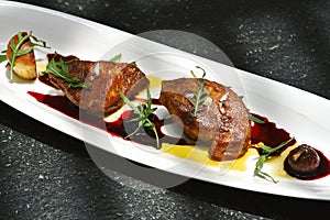 Foie gras grilled served with red berries sauce.