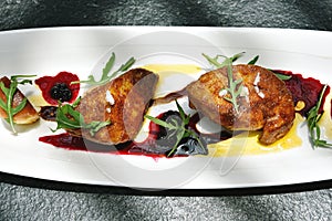 Foie gras grilled served with red berries sauce.