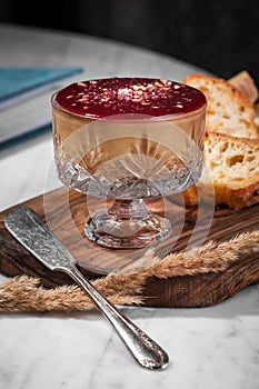 Foie gras pate with cherry jam in a glass bowl