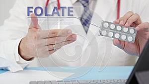 Folate blister pack with tablets in doctor`s hand