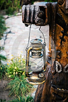 Folclore details. kerosene lamp in hands photo