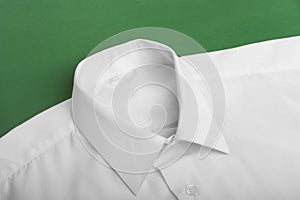 Fold long sleeves shirt on green background