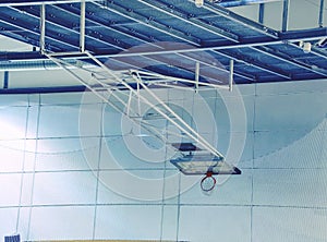 Fold orange basketball hoop with white net in indoor  gym