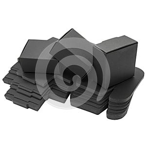 Foldable black paper boxes. Isolated photo