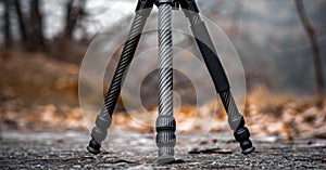 A foldable tripod with a carbon fiber frame and interchangeable lens attachments for versatile use