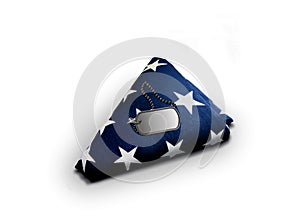 Folded American Flag with Military Dog-tag