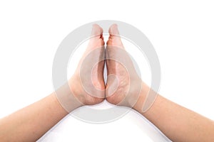 Folded baby feet. White background