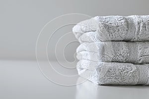 Folded Bath Towels on Table