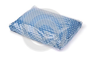 Folded bedding set in plastic storage bag