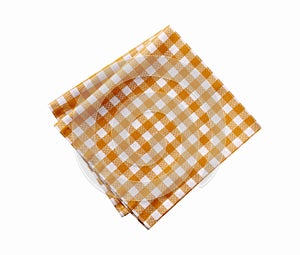 Folded checked yellow tablecloth isolated on white.Picnic orange cloth,dish towel,food decor