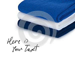 Folded cloths stack with space for text ,isolated on white