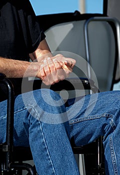 Folded Hands in a Wheelchair