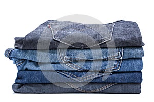 Folded jean stack on white background