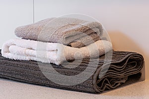 Folded kitchen towels different colors.