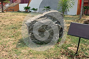 Folded layers of calc-silicate rock one type of metamorphic rock from a mountain, Thailand on ground field photo