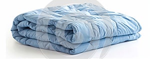 Folded light blue comforter on white background, cozy bedding concept
