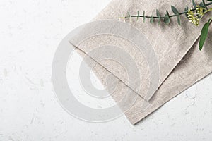 Folded linen napkin on marble table