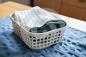 folded microfiber cleaning cloth in a laundry basket