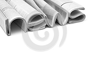 Folded modern newspapers. Concept of business news and print media