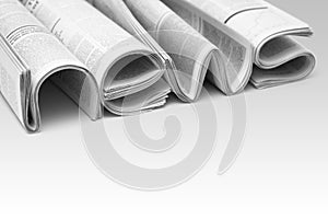 Folded modern newspapers. Concept of business news and print media