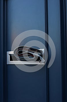 Folded Newspaper Inside Modern Metal Mailbox Representing News Delivery And Communication