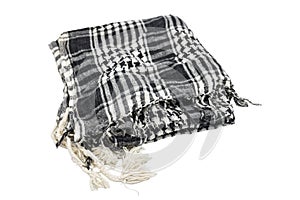 folded Palestinian scarf on white background.