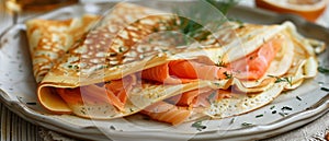 Folded pancakes with smoked salmon on the plate. Horizontal banner 7:3