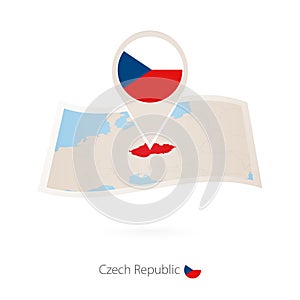Folded paper map of Czech Republic with flag pin of Czech Republic