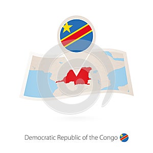 Folded paper map of Democratic Republic of the Congo with flag pin of DR Congo