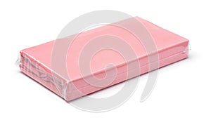 Folded pink cotton bedding sheets in clear plastic bag