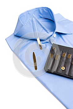 Folded shirt with gold collar stays