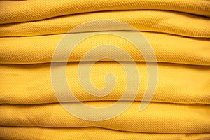 folded stacked Yellow Sherpa fabric backdrop pattern can be used as a textured background