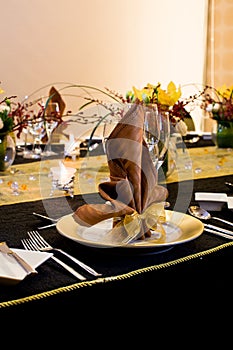 Folded table napkin in formal table setting