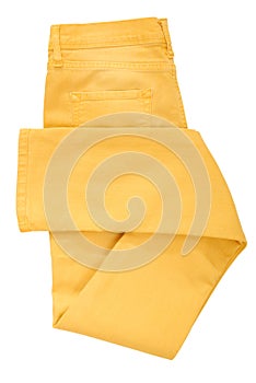 Folded yellow jeans photo