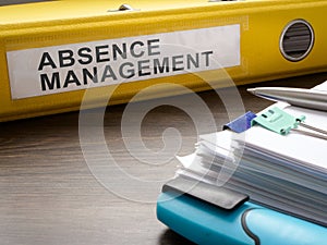 Folder about absence management and papers. photo